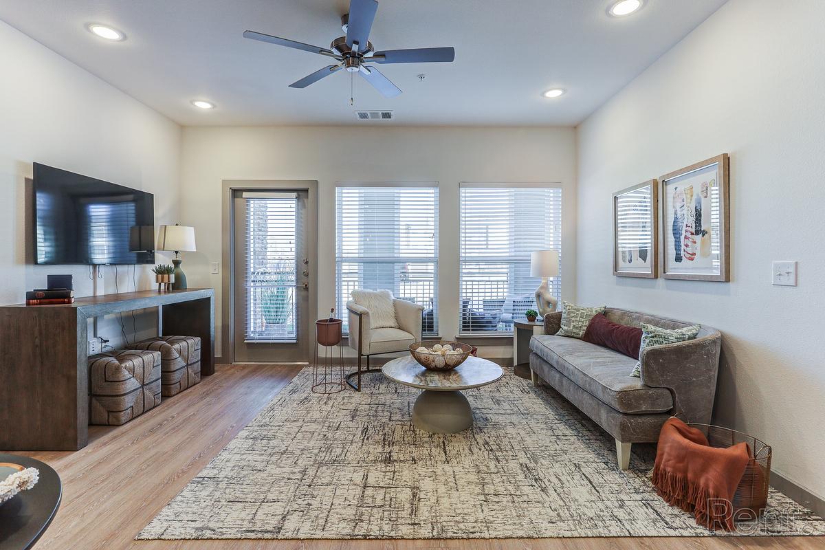 Staged living room with natural light in an apartment home