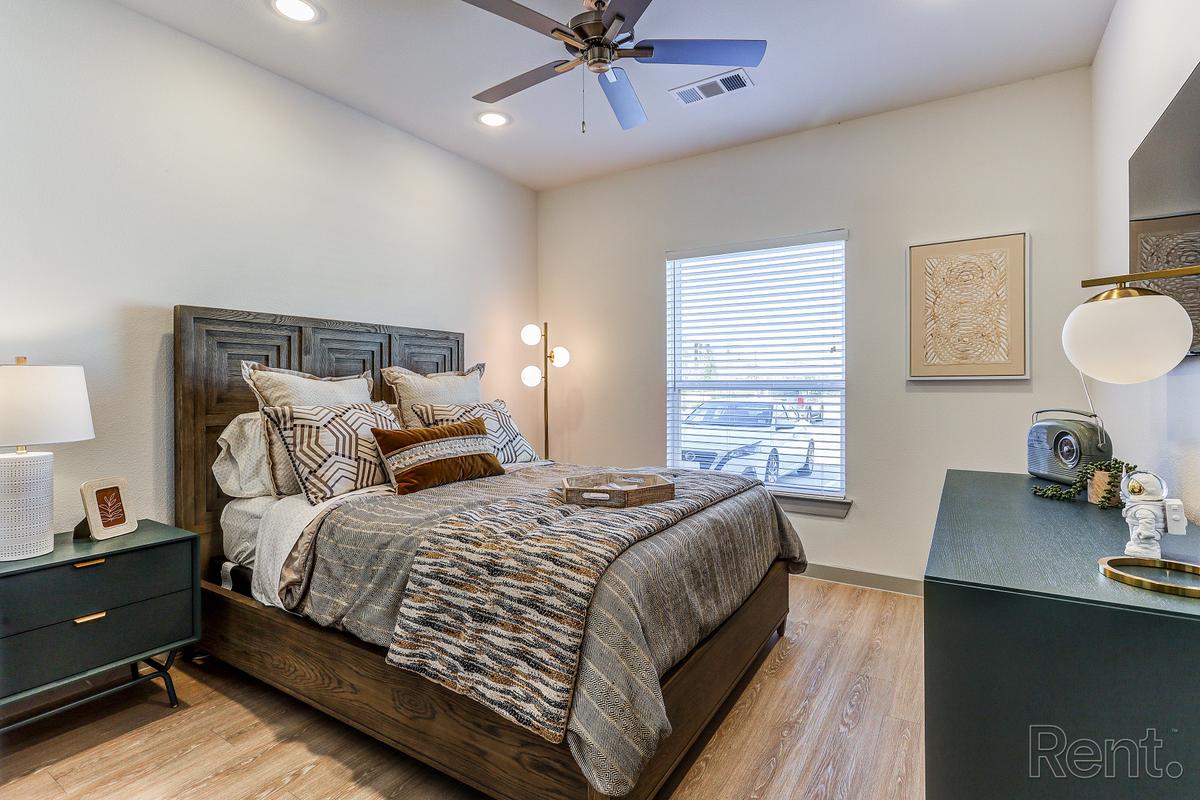 Bedroom with recessed lighting and window