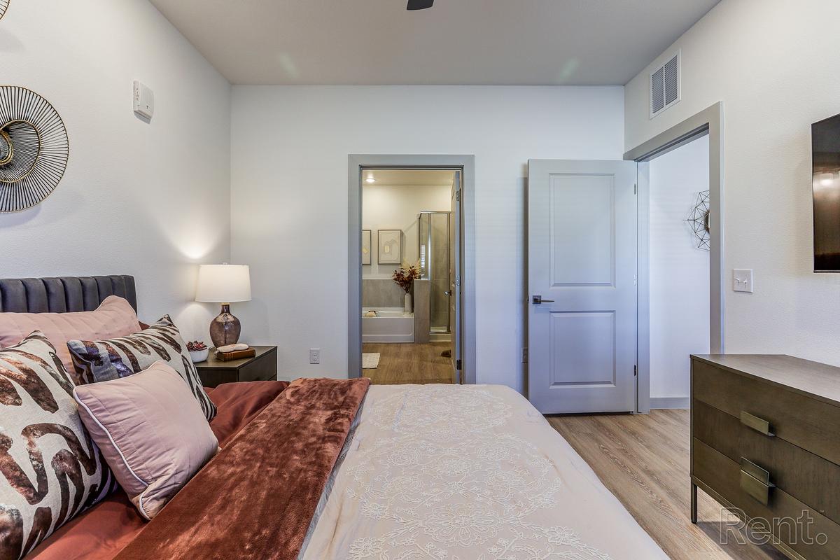 Bedroom staged with bedside seating